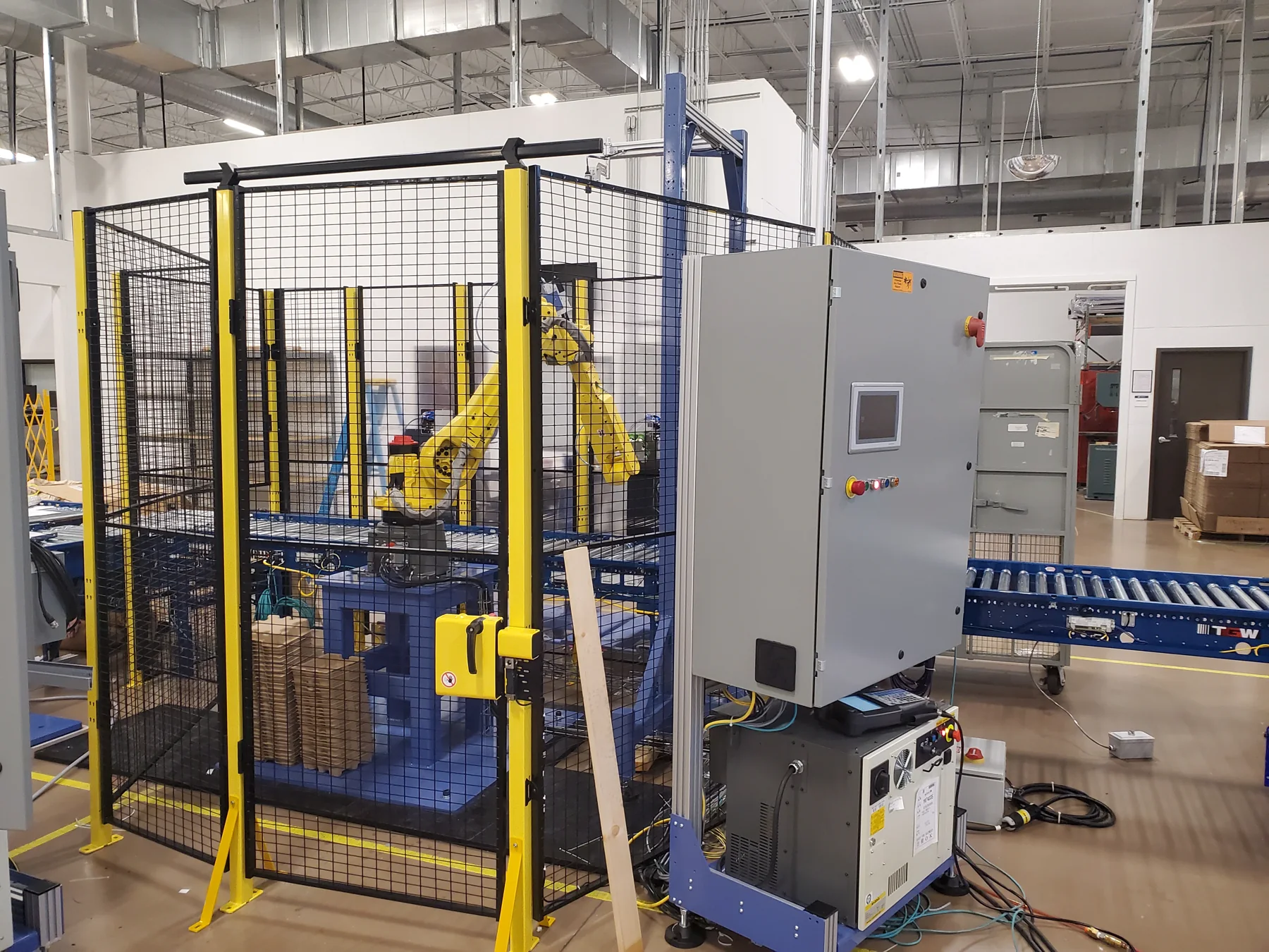 Guarded robot cell and conveyor equipment