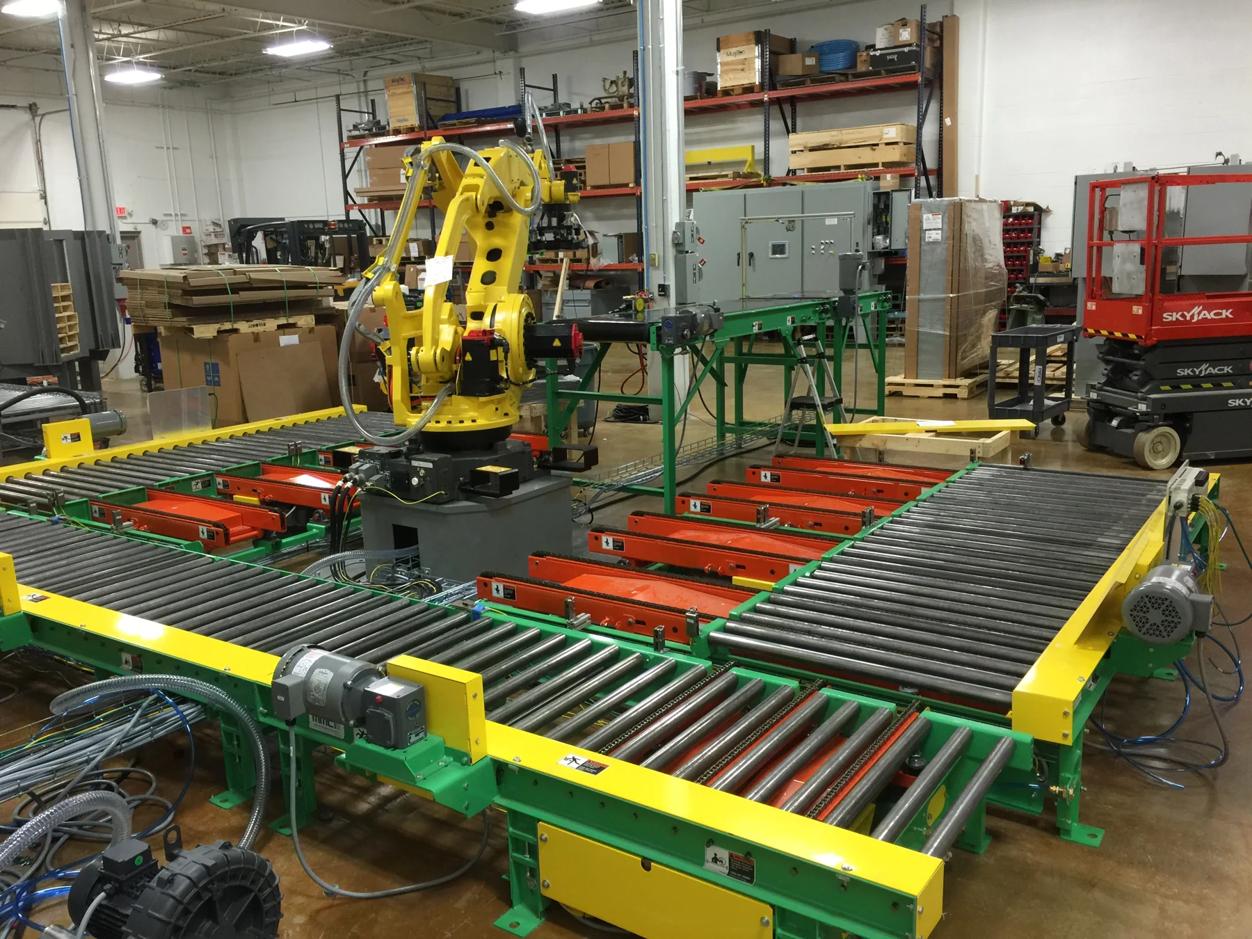 Industrial robot and roller conveyor system